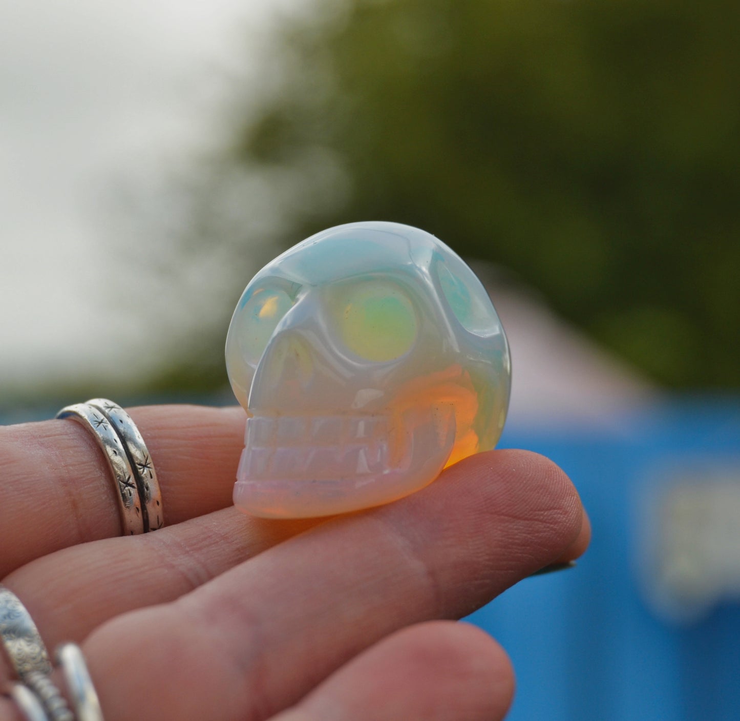 Carved Opalite Crystal Skull – Iridescent Healing Stone Decor and Collectible