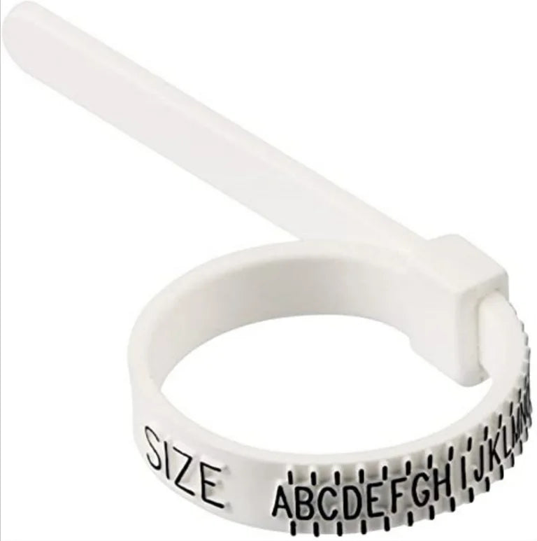 Close-up image of a white plastic adjustable ring sizer tool with alphabetic size markings from A to Z. The sizer has a handle for easy adjustment and accurate measurement of finger size for rings.

